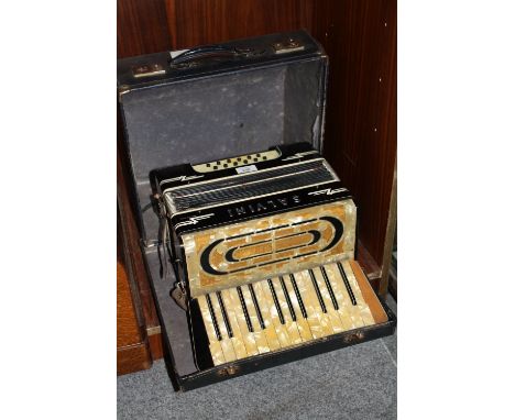 A CASED VINTAGE SALVINI ACCORDION