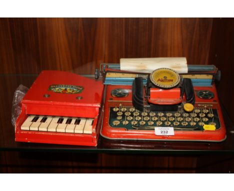 A VINTAGE METTYPE JUNIOR TINPLATE TYPEWRITER TOY, TOGETHER WITH A BABY ORCHESTRA PIANO