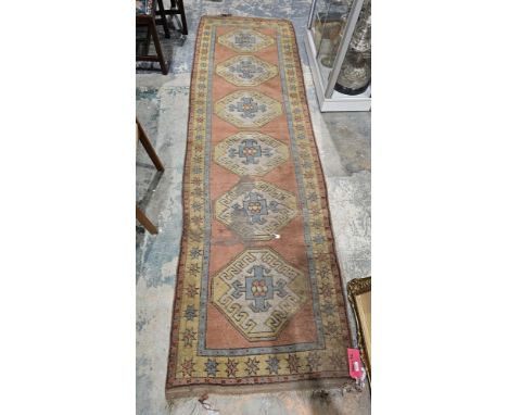 Eastern green ground runner&nbsp;with six central octagonal medallions, multiple floral and geometric borders (quite worn), 3