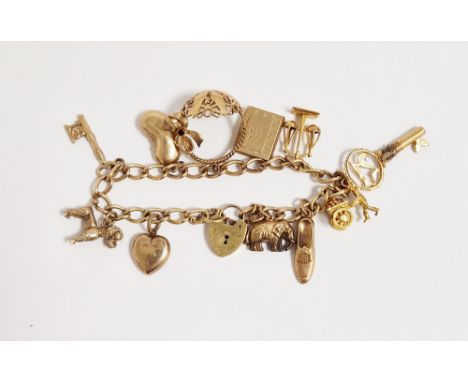 9ct gold oval loop charm bracelet&nbsp;with padlock clasp and multiple charms including scales and poodle, 27.8g total approx