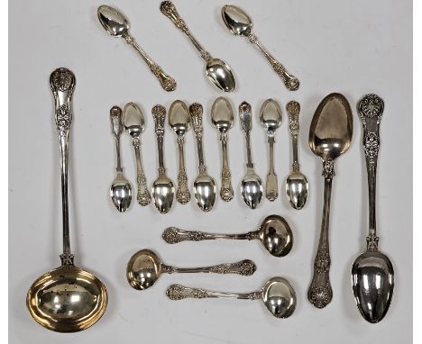 A matched set of George IV and William IV silver spoons, including a large silver serving ladle, approximately 35cm long; tog