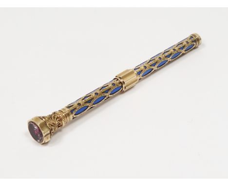 Gold-coloured metal and enamel propelling pencil&nbsp;set with stone to the end, foliate decorated and engraved with filigree