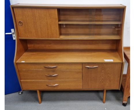Avalon mid-century teak wood highboard&nbsp;having a raised open back top with a single shelf, sliding door and glazed compar
