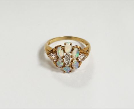 9ct gold, opal, diamond and pink stone dress ring set six opals, small diamonds to the centre flanked by two triangular pale 