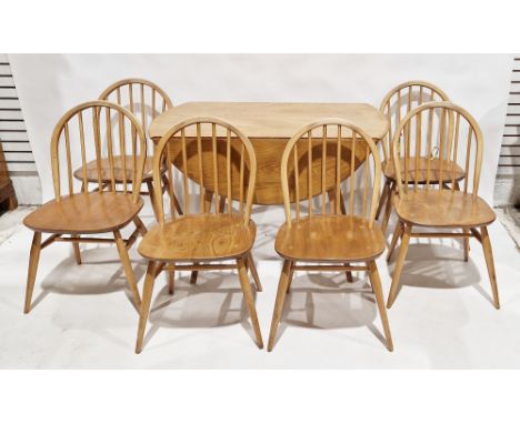 Ercol "Windsor" blonde elm and beech drop-leaf kitchen/dining table, model 284, raised on splayed supports, together with six