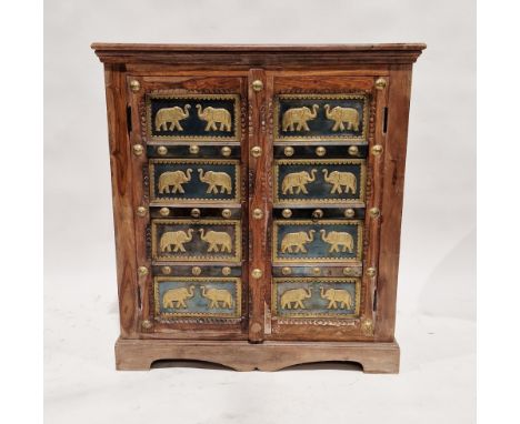 20th century stained hardwood Indian cupboard, the doors with embossed brass metal panels depicting elephants, opening to&nbs