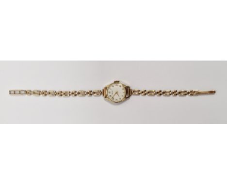 Vintage lady's Seiko wristwatch, the circular cream dial having Arabic hour markers, quartz movement, on a 9ct gold bracelet,
