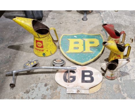 Collection of vintage motoring items to include a metal BP sign painted green and yellow, a Shell X100 Motor Oil jug, a Shell