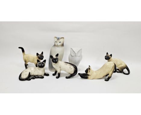 Two Beswick pottery models of Siamese cats and three similar, printed black marks and impressed shape number 1559 to one, 16.