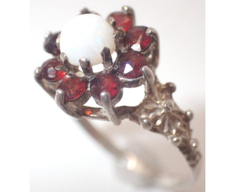 Silver ring set with opal and garnets size K