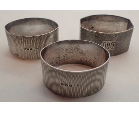 Three engine turned hallmarked silver napkin rings 82g