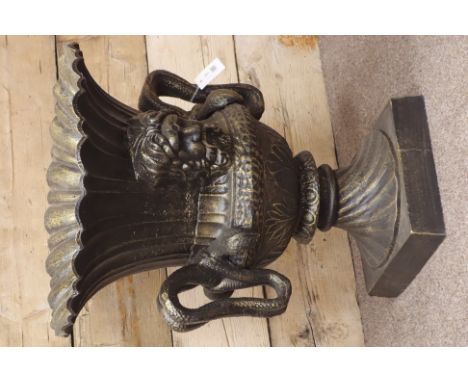 Large bronze finish circular pedestal urn, wavy border, twin snake handles, mask features, W62cm, H73cm