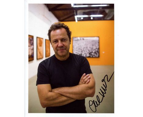 MUNIZ VIK: (1961- ) Brazilian artist and photographer. Signed colour 8 x 10 photograph of Muniz standing in a half-length pos