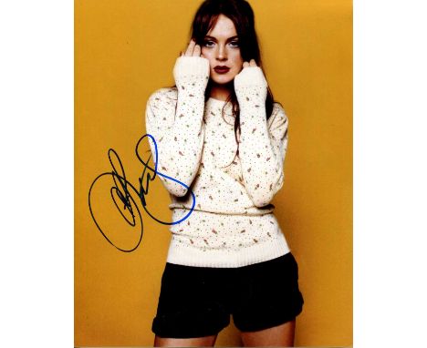 LOHAN LINDSAY: (1986- ) American actress and singer. Signed colour 8 x 10 photograph of Lohan standing in a three-quarter len