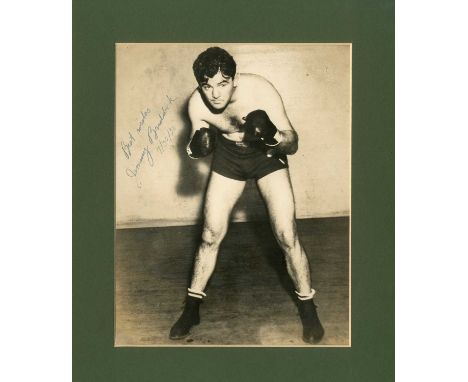 BRADDOCK JAMES J.: (1905-1974) American boxer, World Heavyweight Champion 1935-37. Vintage signed sepia 7 x 9 photograph of B