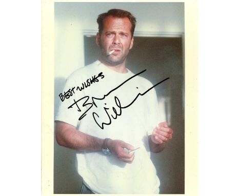 WILLIS BRUCE: (1955- ) American actor. Signed colour 8 x 10 photograph of Willis standing in a half-length pose as he prepare