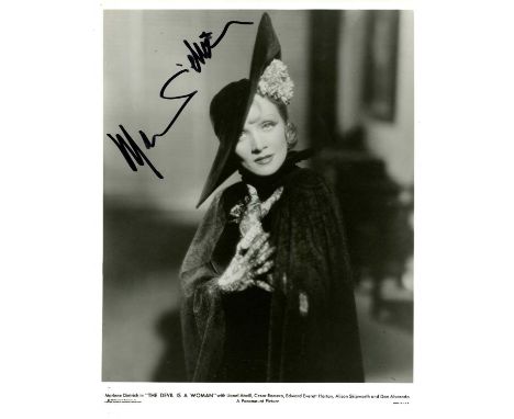 DIETRICH MARLENE: (1901-1992) German-born American actress and singer. Signed 8 x 10 photograph of Dietrich standing in a hal