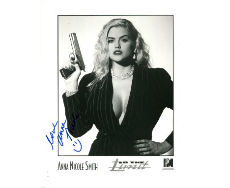 SMITH ANNA NICOLE: (1967-2007) American actress and model. Signed 8 x 10 photograph of Smith standing in a sultry half-length