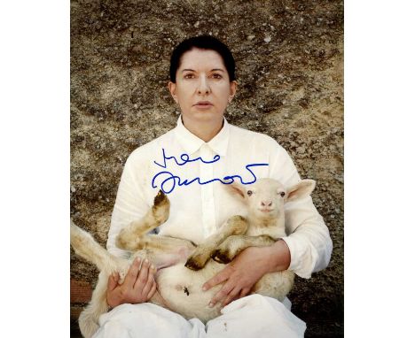 ABRAMOVIC MARINA: (1946- ) Serbian conecptual and performance artist. Signed colour 8 x 10 photograph of Abramovic seated in 