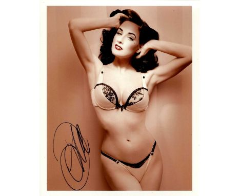 VON TEESE DITA: (1972- ) American vedette, burlesque dancer and model. Signed colour 8 x 10 photograph of Von Teese standing 