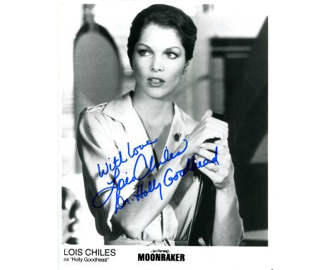 CHILES LOIS: (1947- ) American actress and model. Signed 8 x 10 photograph of Chiles standing in a half-length pose in costum
