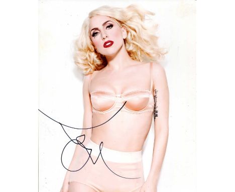 LADY GAGA: (1986- ) American singer and actress. Signed colour 8 x 10 photograph of the blonde singer standing in a three-qua