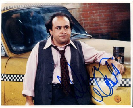 DEVITO DANNY: (1944- ) American Actor &amp; Comedian. A good signed 10 x 8 colour photograph of DeVito, standing before a tax