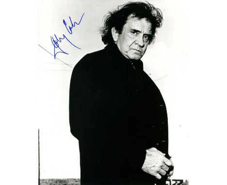 CASH JOHNNY: (1932-2003) American Singer &amp; Songwriter. Signed 8 x 10 photograph by Cash, the image depicting the singer s