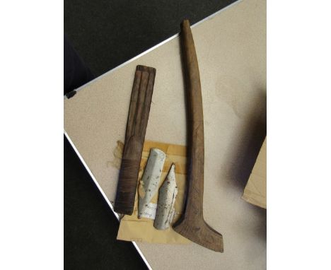 An African, possibly Gabonese, axe handle bearing cross hatched carving and two associated axe heads.  Handle 56cm, blades 17