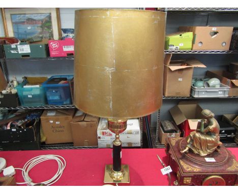 A column form brass table lamp base with distressed gilded shade 