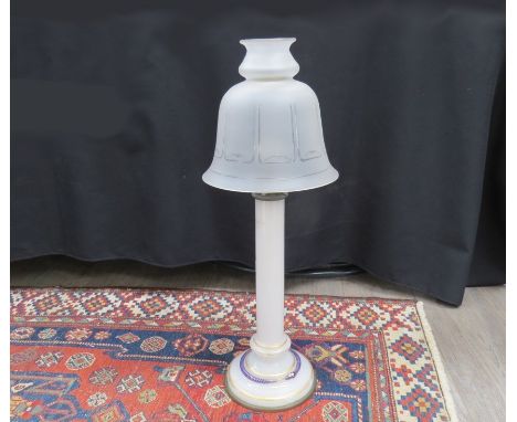 A 19th Century milk glass column candle lamp with gilt banding and blue snake coiled to base (cracked) with a frosted glass s