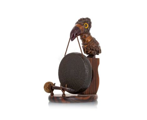 HENRY HOWELL YZ BIRD TABLE GONG, CIRCA 1920-1940 modelled with root wood and Bakelite bird, with bronze gong suspended from b
