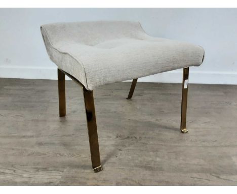 E. GOMME G-PLAN, STOOL, CIRCA 1960-69 the shaped seat upholstered in button back cream fabric, splayed brass supports46cm hig