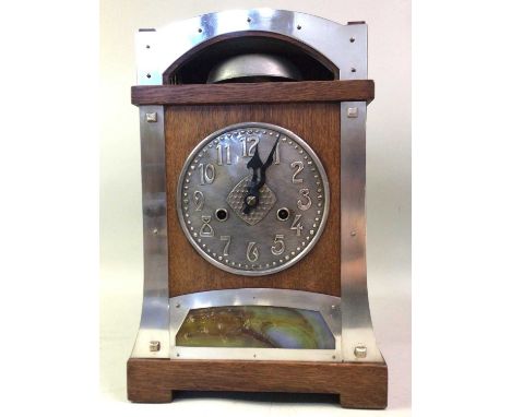 SECESSIONIST OAK MANTEL CLOCK, LATE 19TH CENTURY with twin train eight day movement, pewter dial with Arabic numerals, the ga