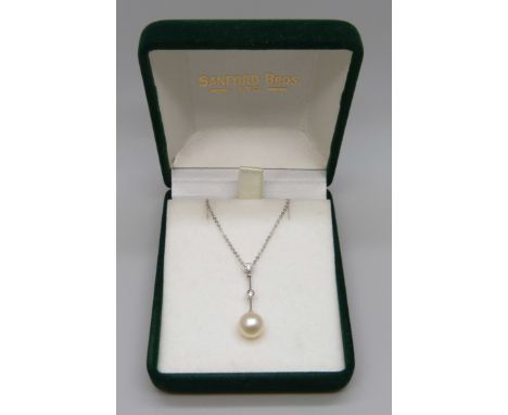 A 9ct white gold, diamond and pearl pendant on a fine 9ct white gold chain, 2.1g, chain 42cm