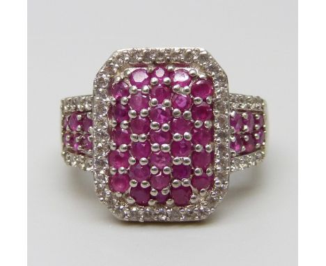 A silver gilt, ruby and zircon pave set ring, M