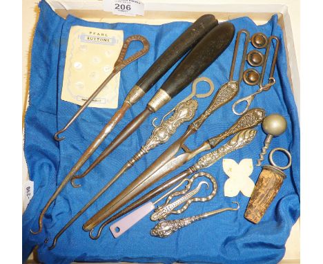 Antique silver handled button hooks, and others, some advertising, corkscrew, silver-topped bottle stopper, sewing items etc