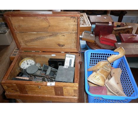 Wooden chest containing antique scales, old mechanical calculator, alarm clock and box of wooden shoe lasts with travel clock