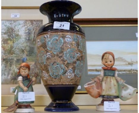 A Royal Doulton Lambeth stoneware vase of ovoid form together with two Goebel Hummel figures.