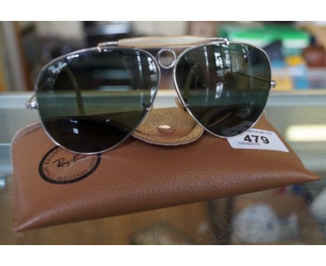 A cased pair of vintage Ray-Ban Aviator sunglasses.