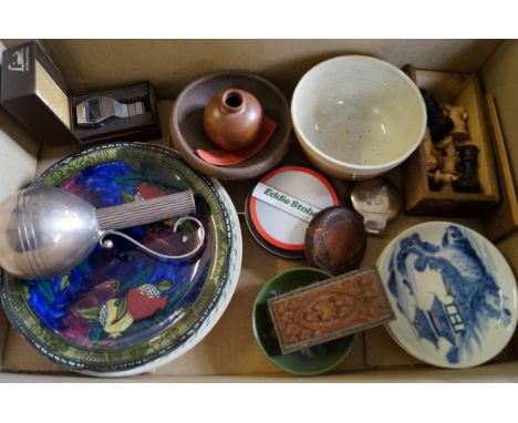 A box of sundry items including a Danish white metal bud vase with scroll handle, a small Moorcroft tubeline dish, Rubens war