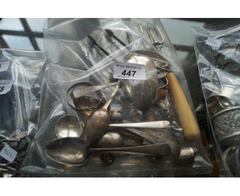 A bag of assorted silver and white metal items teaspoons, thimbles, sugar tongs, ladle (qty)