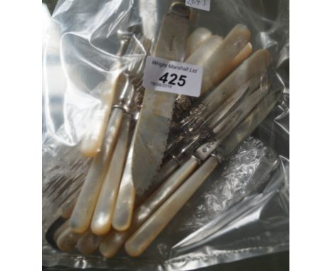 Six mother of pearl handled and silver fruit forks, five conforming knives, four plated mother of pearl handled knives and fo