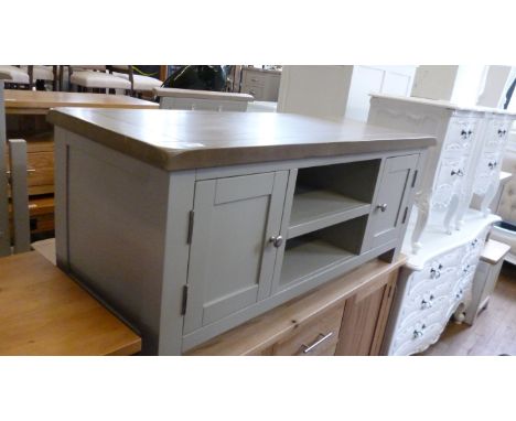 A bleached oak and painted TV stand, with two cupboard doors and an open shelf.