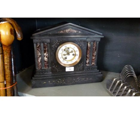 A Victorian slate and rouge marble architectural mantel clock, with a white enamelled dial and two train movement.