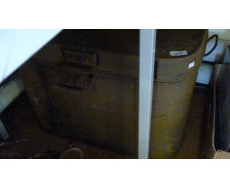 A hinged metal trunk with two side handles.
