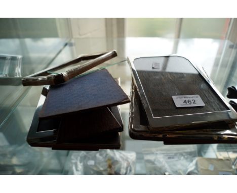 Five assorted silver easel photo frames.