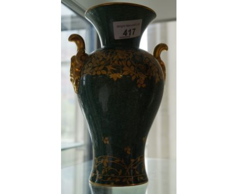 A Royal Worcester mottled green vase with gilt leaf decoration to gilt handles stamped 2474.