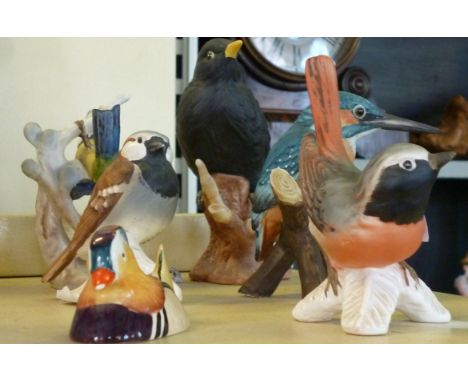 A Beswick model of a mandarin duck, a Goebel figure of a Wagtail, a Goebel figure of a blue tit and three other bird figures 