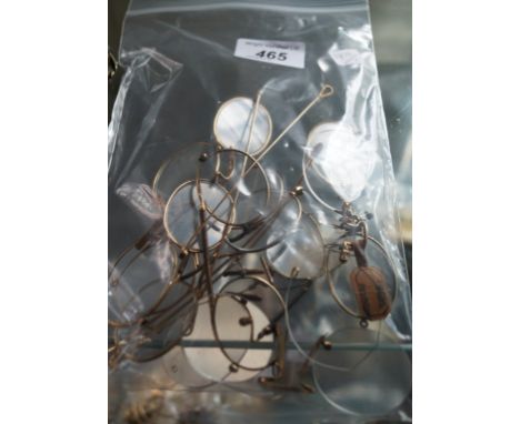 Nine pairs of gold and yellow metal framed vintage spectacles.